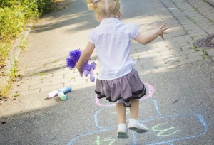 girl playing hopscotch