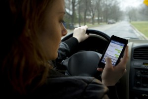 teen girl texting while driving