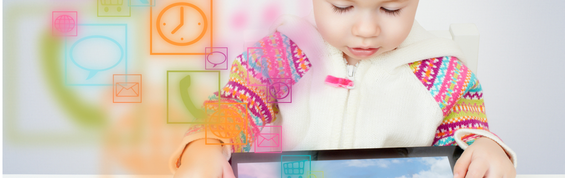 toddler playing with a tablet device