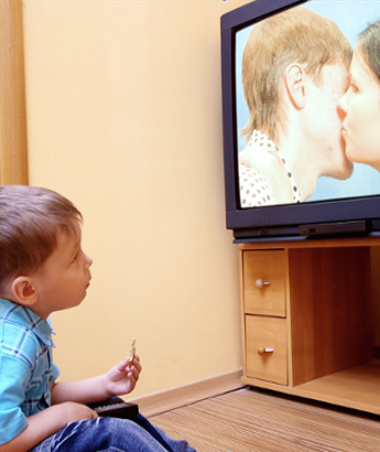 boy watching couple kiss
