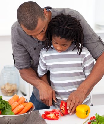 father son cooking