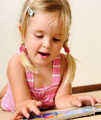 young girl reading a book