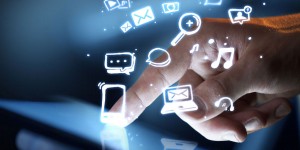 finger on touch screen evoking icons in the air