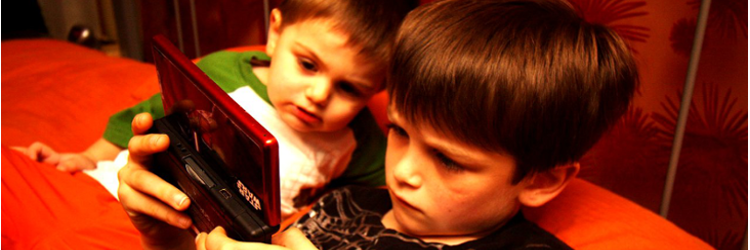 Boys playing DS