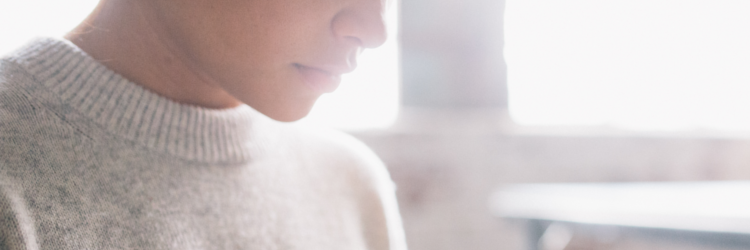 Teen standing and reflecting