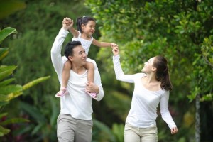 parents with a child at a park