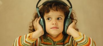 child with large headphones on