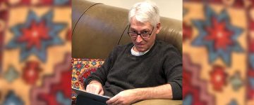 Joe Wolfson using a tablet