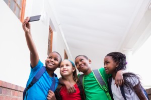 4 kids taking a selfie